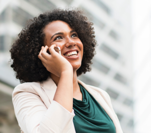 Woman smiling while on mobile phone